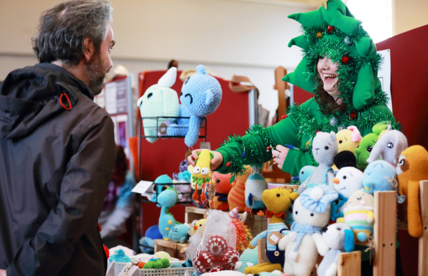 A vendor meets a customer at the Richmond Barracks Christmas Fair. Photo by Senija Topcic.